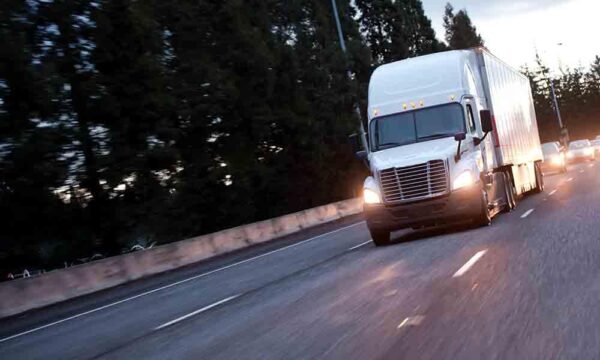 semi truck driving down highway