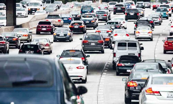 rows of vehicles stuck in traffic on highway