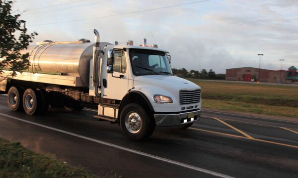 tanker truck driving down highway