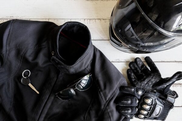 Motorcycle gear including a jacket, helmet, and gloves
