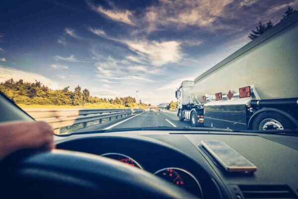 Driving alongside tractor trailer on highway