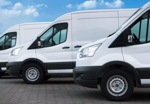 Line up of white delivery vans