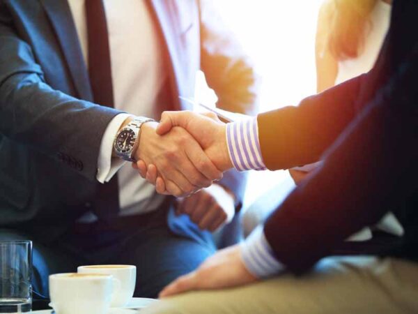 Man shaking hands with truck accident attorney