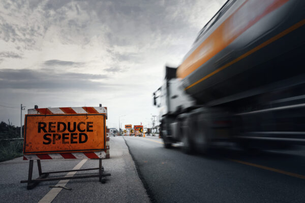 Tanker truck speeding through a construction site