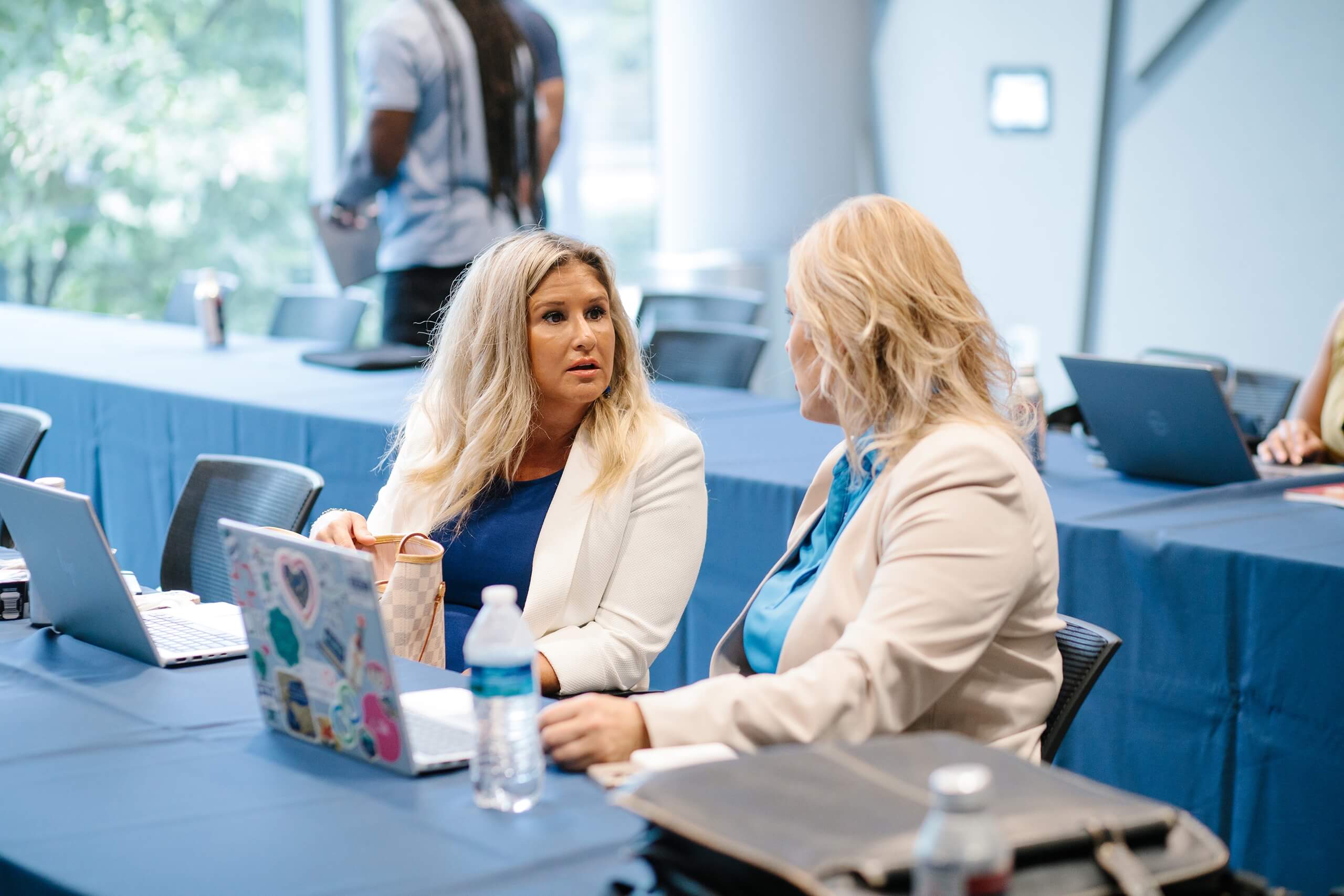 Participants talk during a session break at Trial Skills Clinic 2025.
