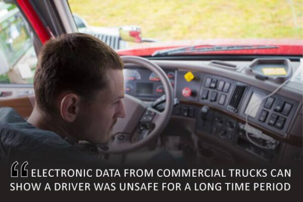 Truck driver in commercial truck with complex dashboard